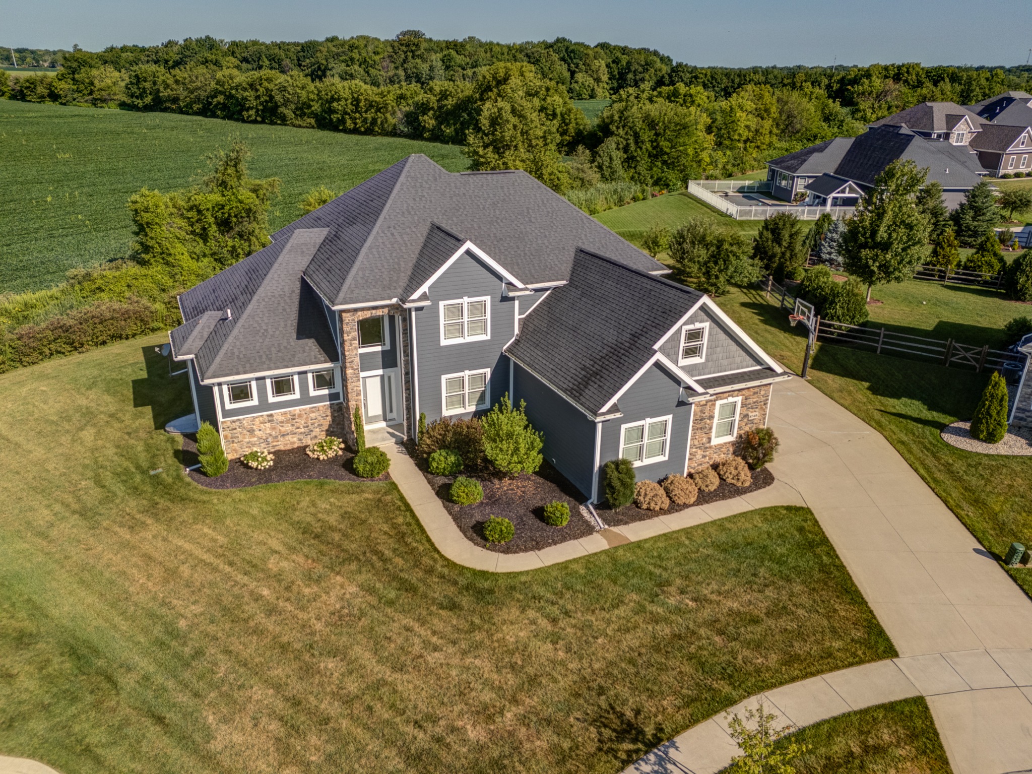 High aerial view showing the home and its open lot