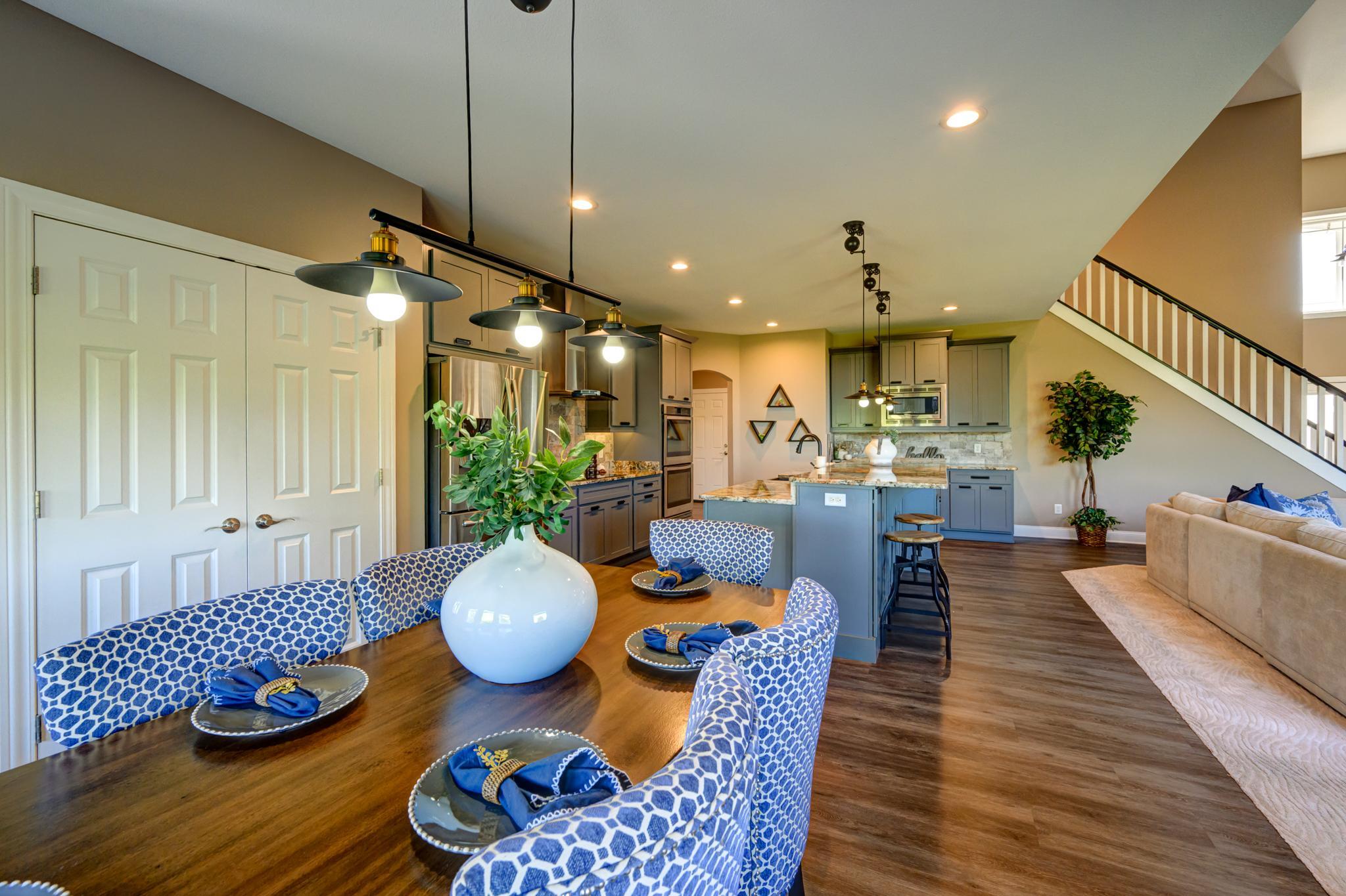 Dining area looking into the kitchen and living room
